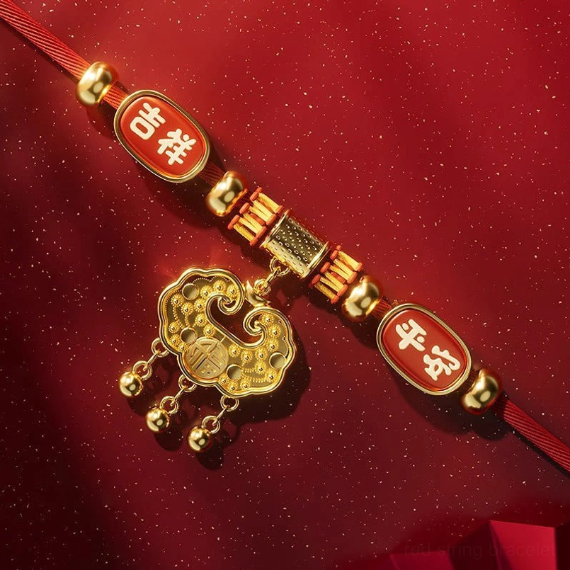 Red string pet collar with golden lock charm and sacred Chinese blessing symbols detail