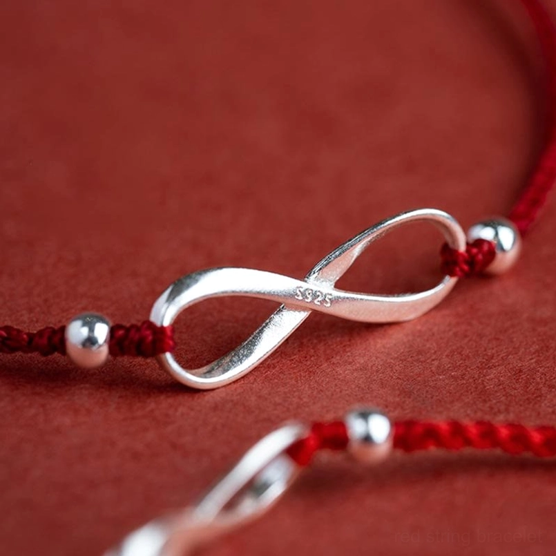 Red string protection bracelet with sterling silver endless knot styling