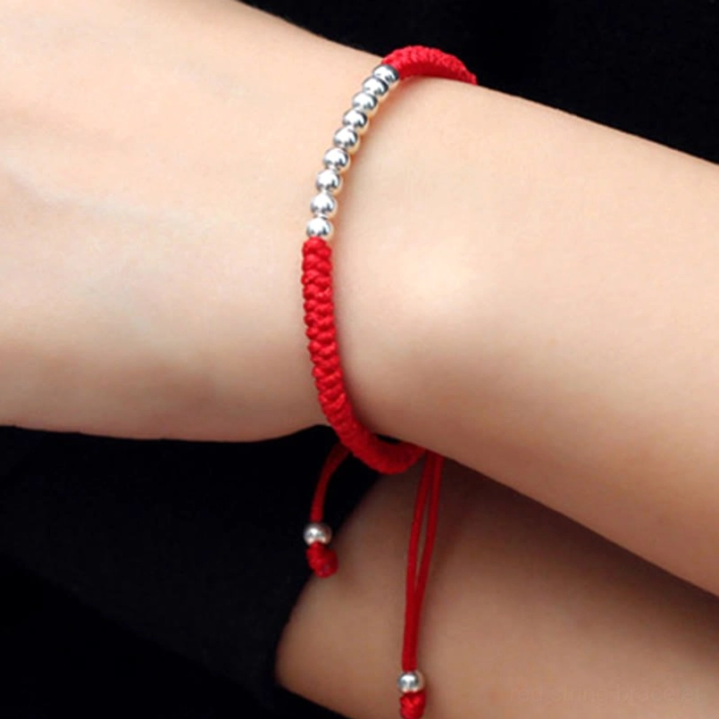 Red 925 sterling silver red string bracelet worn on wrist