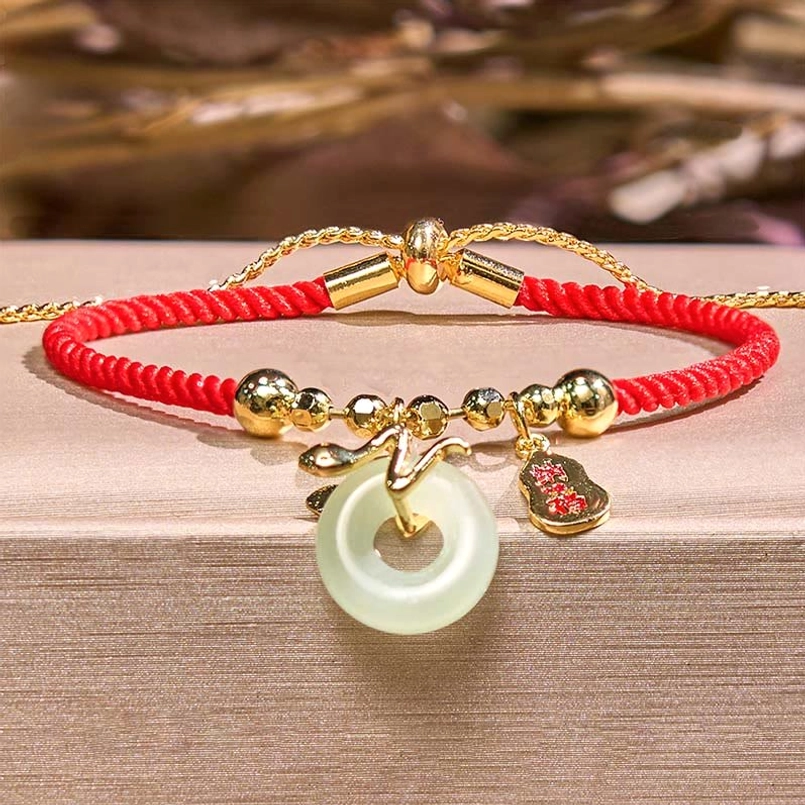Adjustable red string lucky bracelet with sliding knot jade peace buckle and gold accents