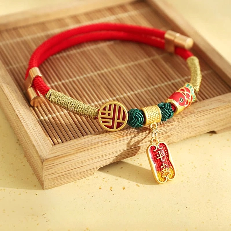 Adjustable red string cat collar with metal clasp and blessing beads side view