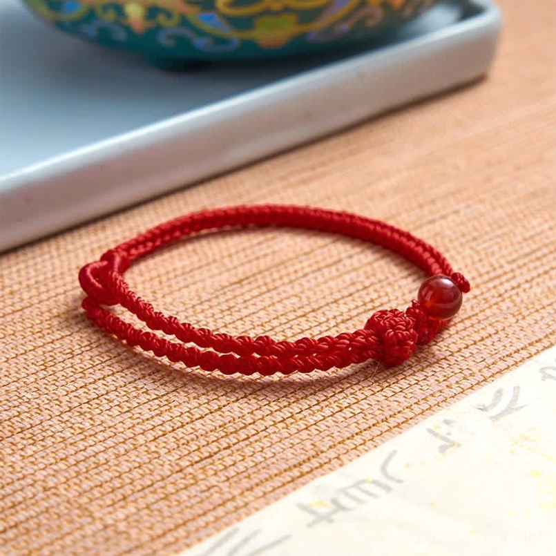 Red string balance bracelet handmade craftsmanship and quality detail
