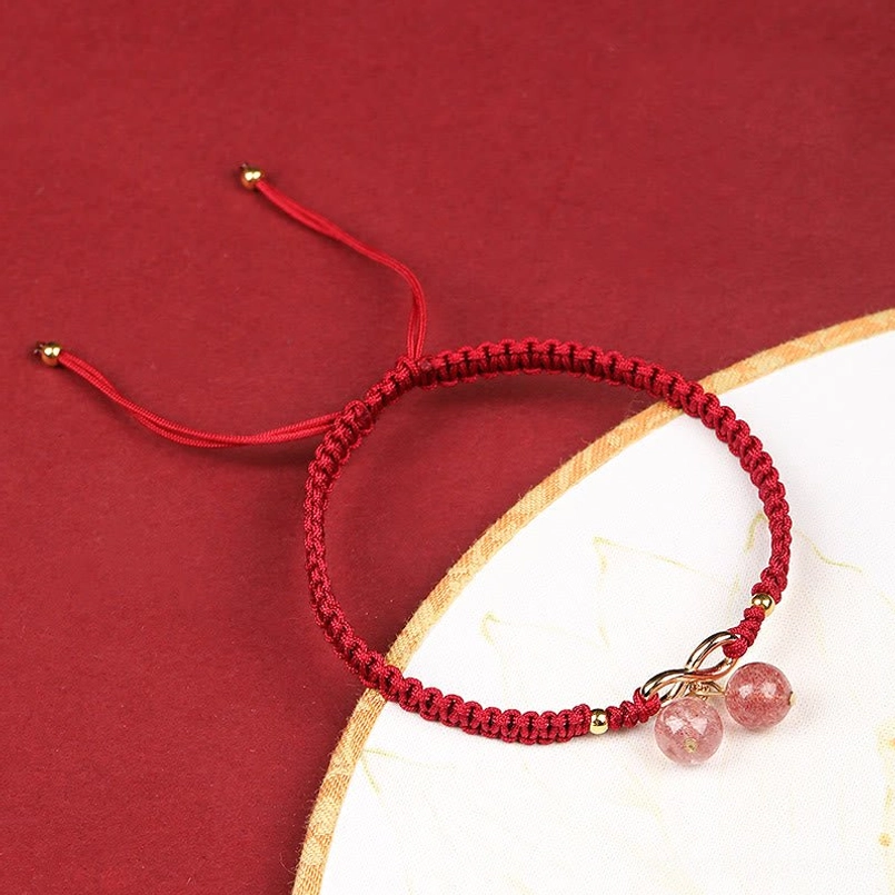 Adjustable Red String Bracelet with Strawberry Quartz - Side View Wrist Fit