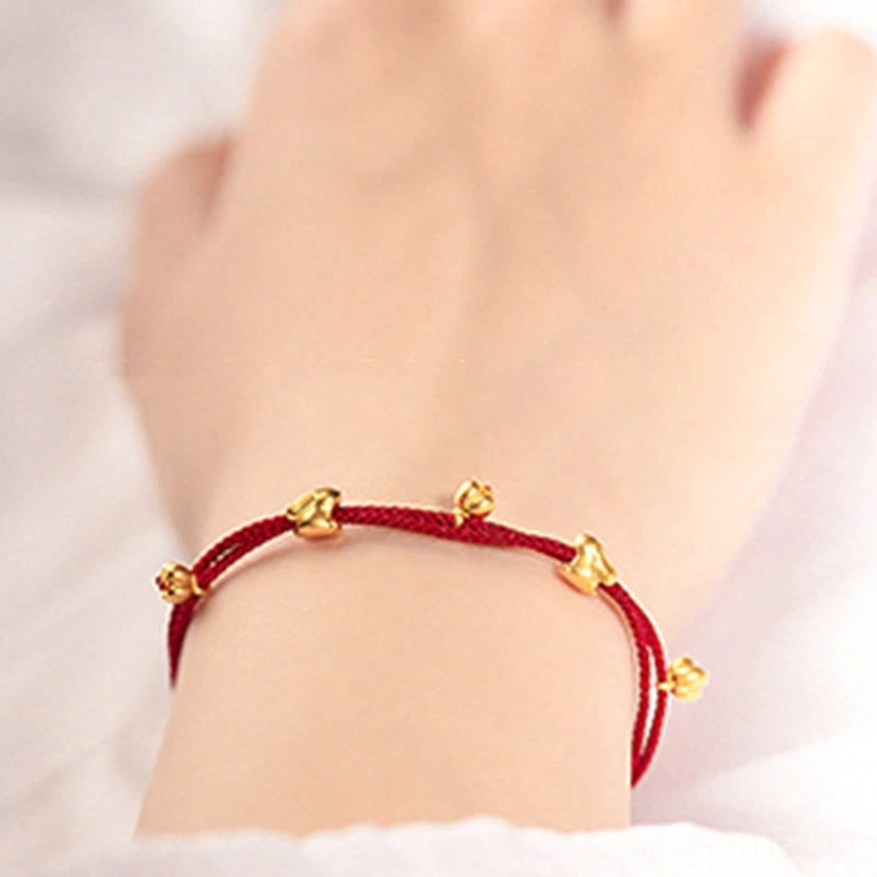 999 gold lucky rabbit red string bracelet adjustable sliding knot close up