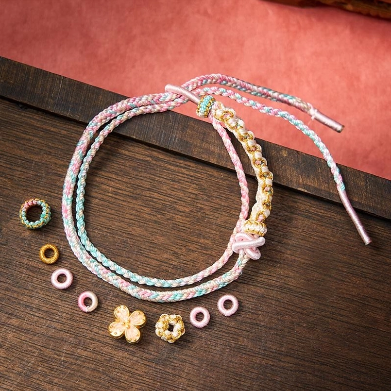 Red double layer woven bracelet with adjustable sliding knot mechanism