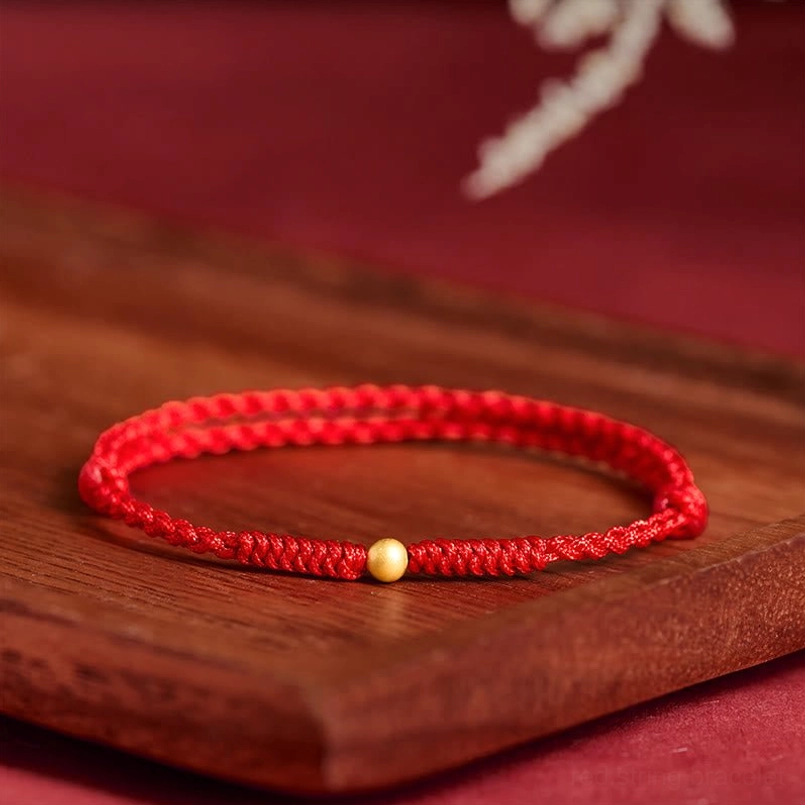 Adjustable red string bracelet, versatile fit for wrist or ankle