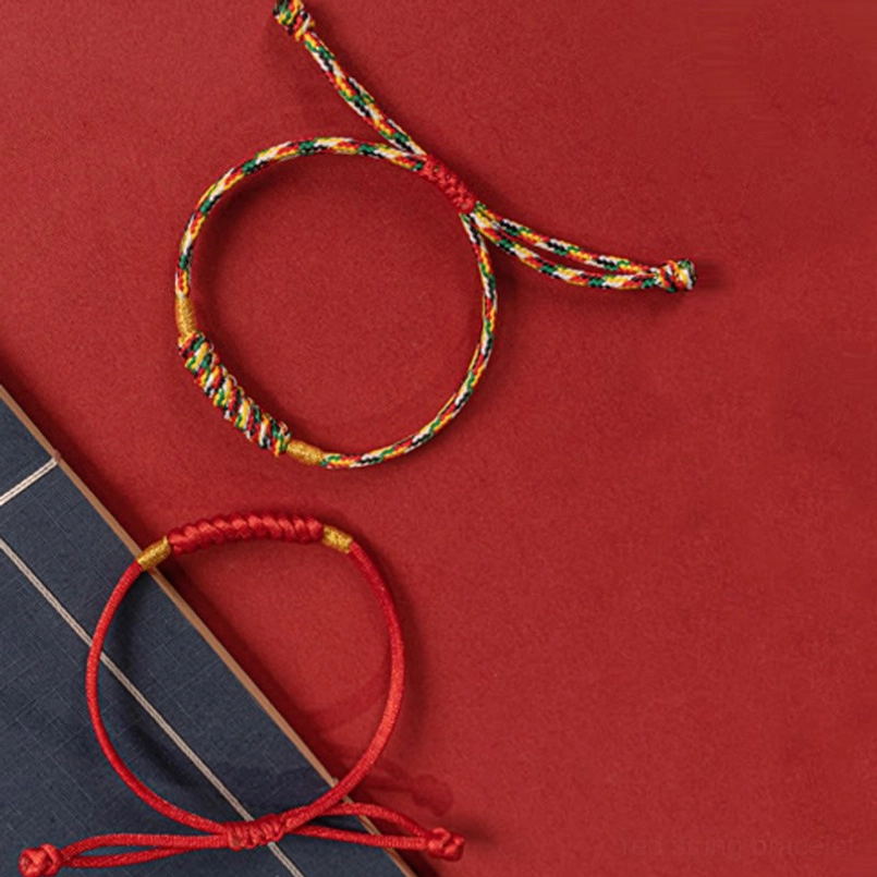 Red string bracelet adjustable knot demonstration showing easy size adjustment
