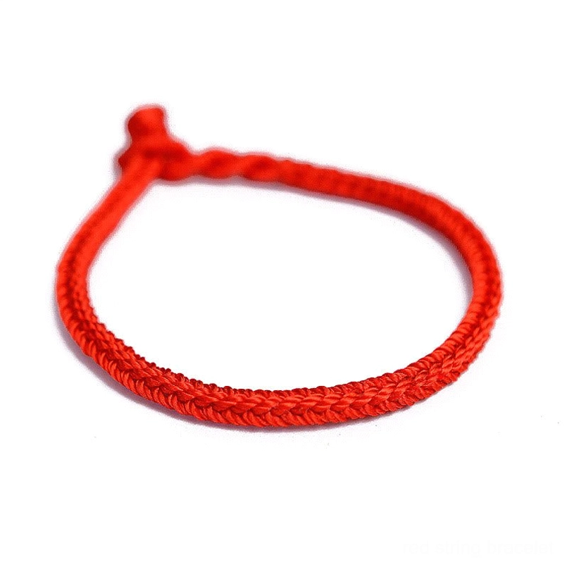 Handmade red string bracelet with braided cord and knot closure detail