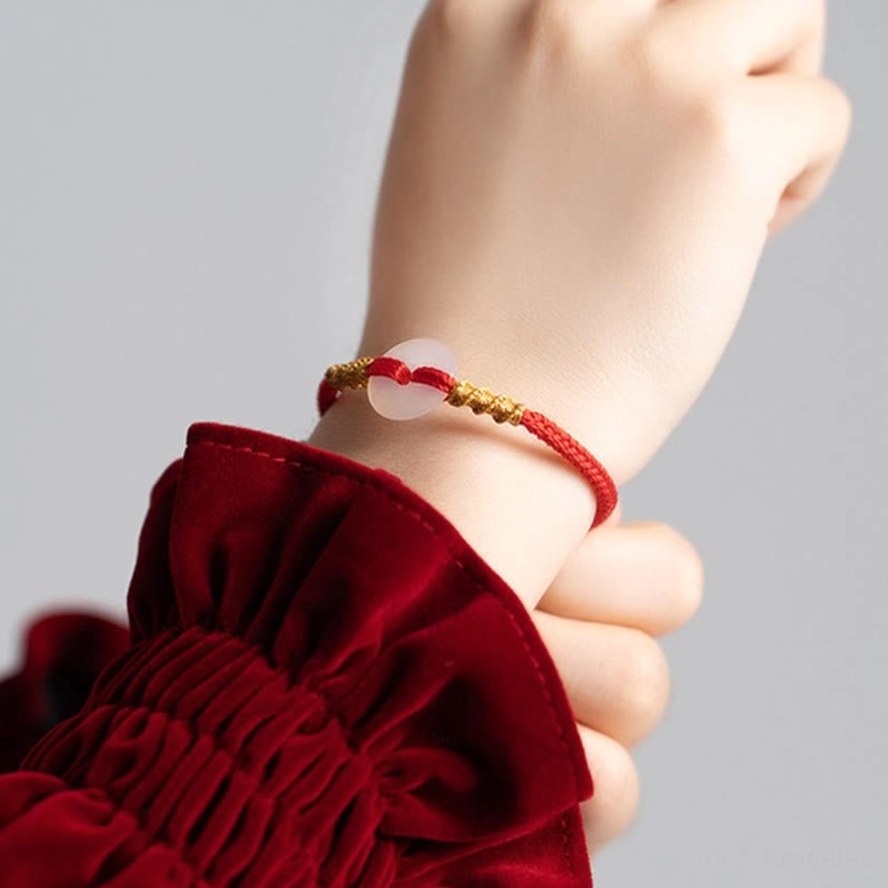Red string peace buckle bracelet with premium braided cord and translucent chalcedony stone
