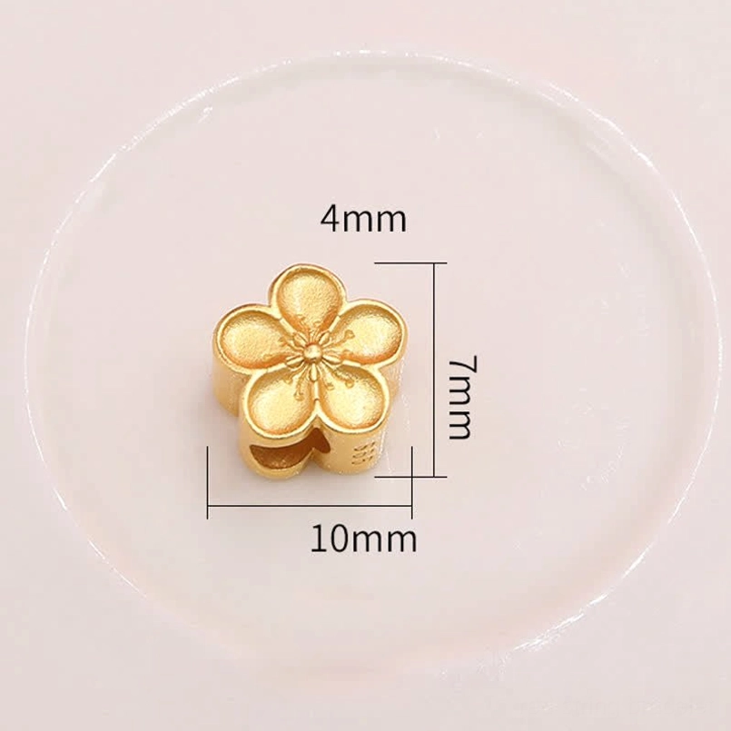 Gold flower charm size reference 4mm 7mm 10mm specifications close-up