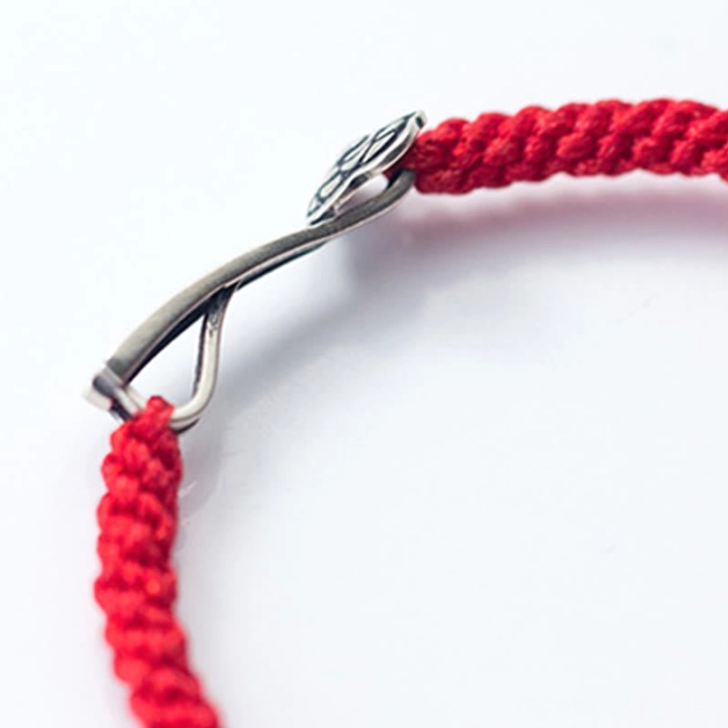Adjustable bracelet hook clasp close-up showing woven red cord and 925 silver clasp mechanism