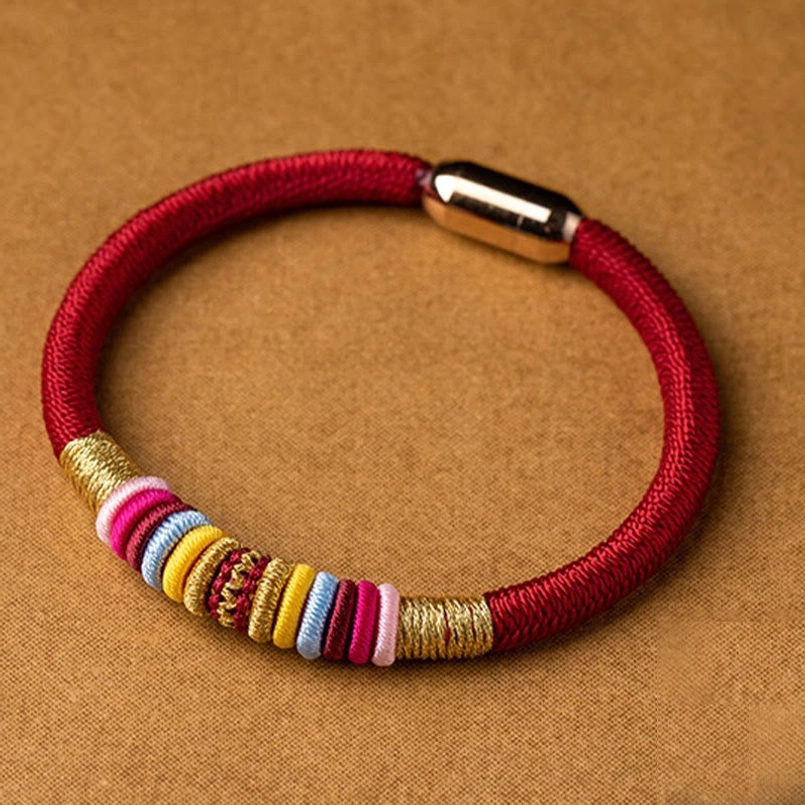 Premium red woven King Kong Knot bracelet with multicolor thread wraps and shiny metal magnetic buckle