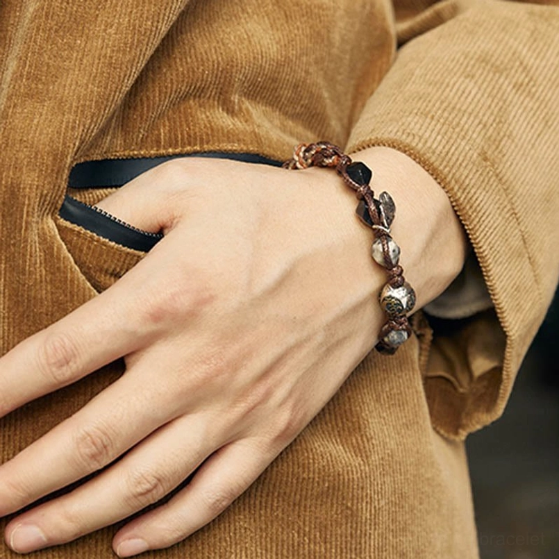 red string bracelet worn on wrist with casual outfit daily look