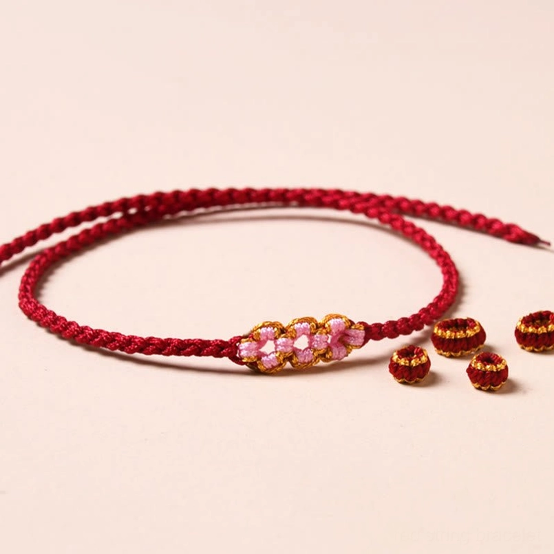 Handmade red string bracelet making kit with loose beads and flower charms