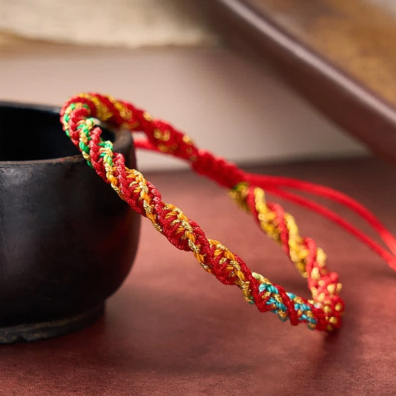 Ethnic style handwoven red string bracelet with multicolor threads and red drawstring