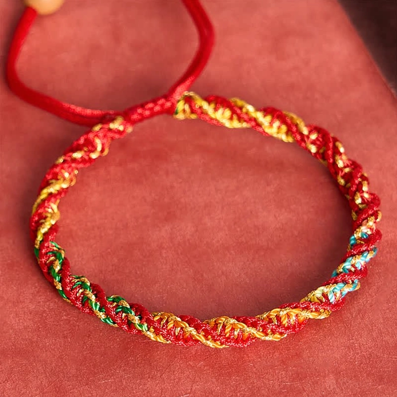 Festival red string bracelet with twisted multicolor weaving and adjustable red cord