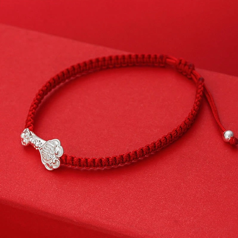 Handcrafted Ruyi Fu Red String Bracelet - Flat Lay Circular View with Sliding Adjustment Knot Detail
