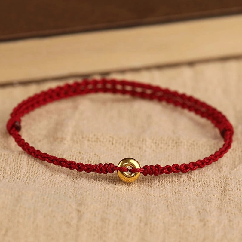 handmade red string protection bracelet with gold peace buckle detail shot