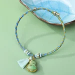 Green Song Brocade Red String Bracelet with Gourd Charm and Tassel - Eastern Protection Talisman