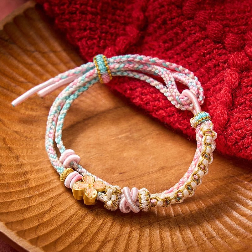 Handwoven red string bracelet detail showing traditional knot craftsmanship
