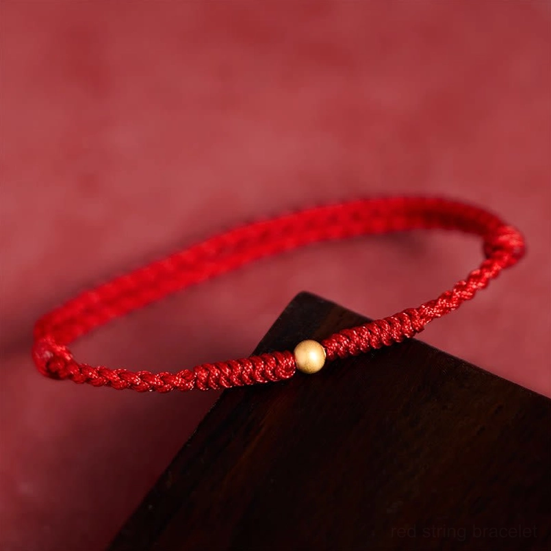 Fortune red string bracelet with gold accent, detailed knot work