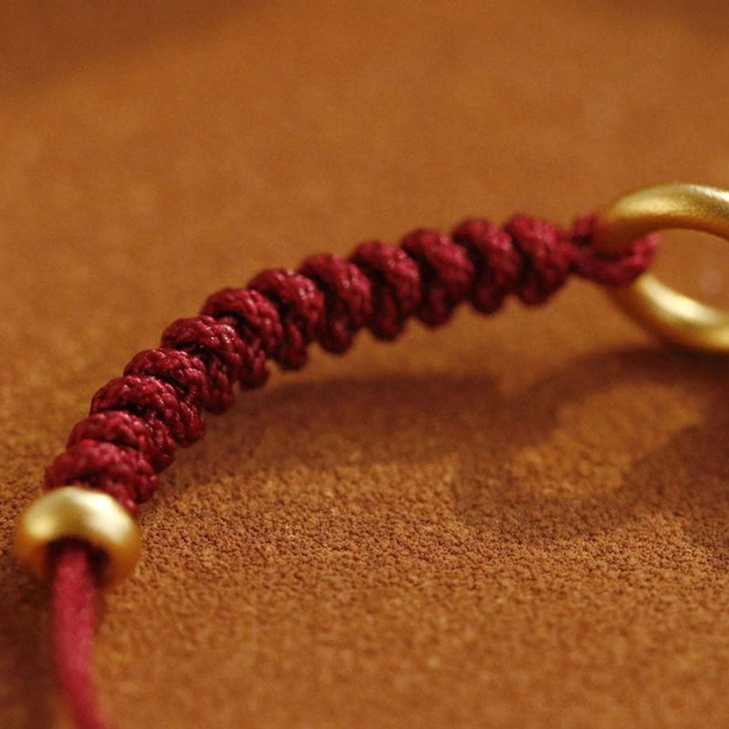 Red String Bracelet Braided Knot And Gold Hardware Detail Close Up