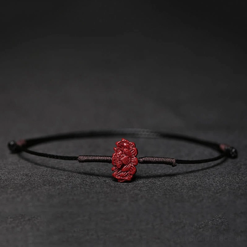 Red cord bracelet with lotus charm for enlightenment renewal