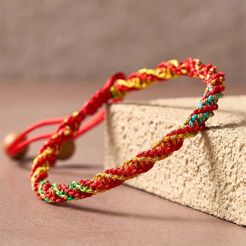 Lucky woven red string bracelet with colorful braided threads and wooden adjuster bead