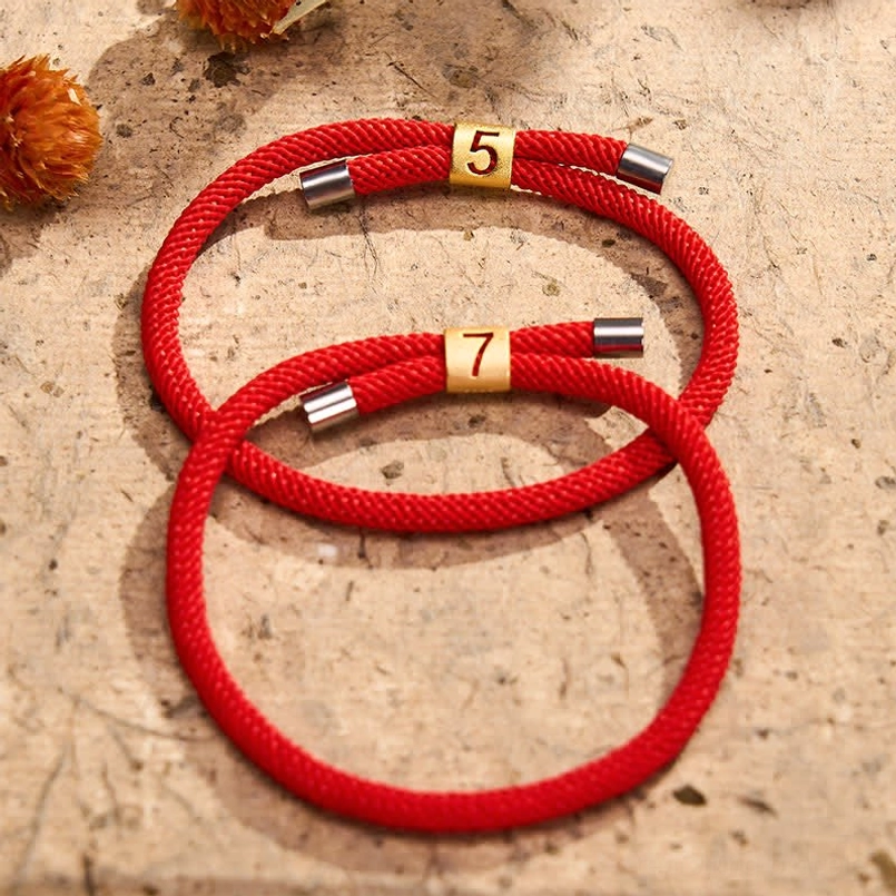 Red string adjustable bracelet silver metal end cap detail