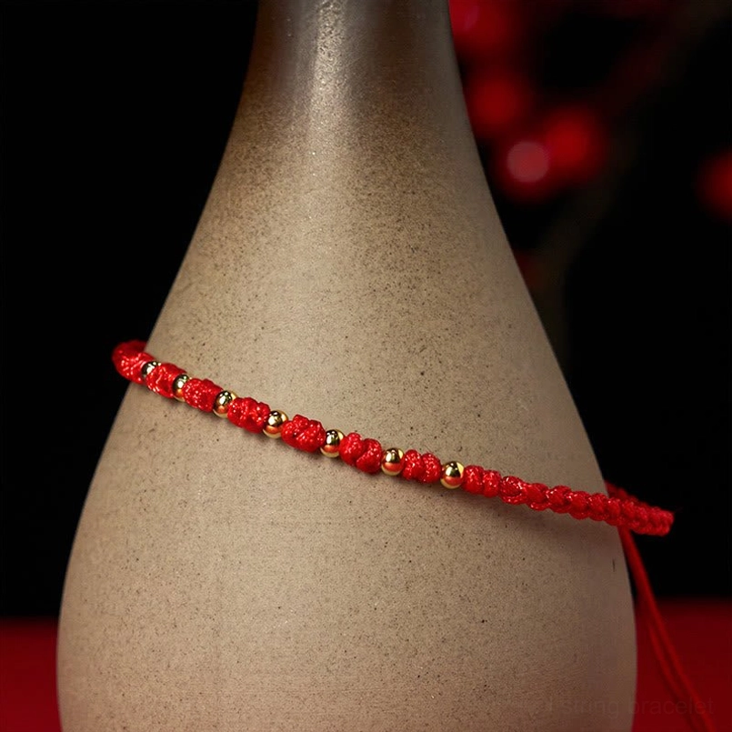 Red braided protection bracelet with mixed gold and silver beads slim design