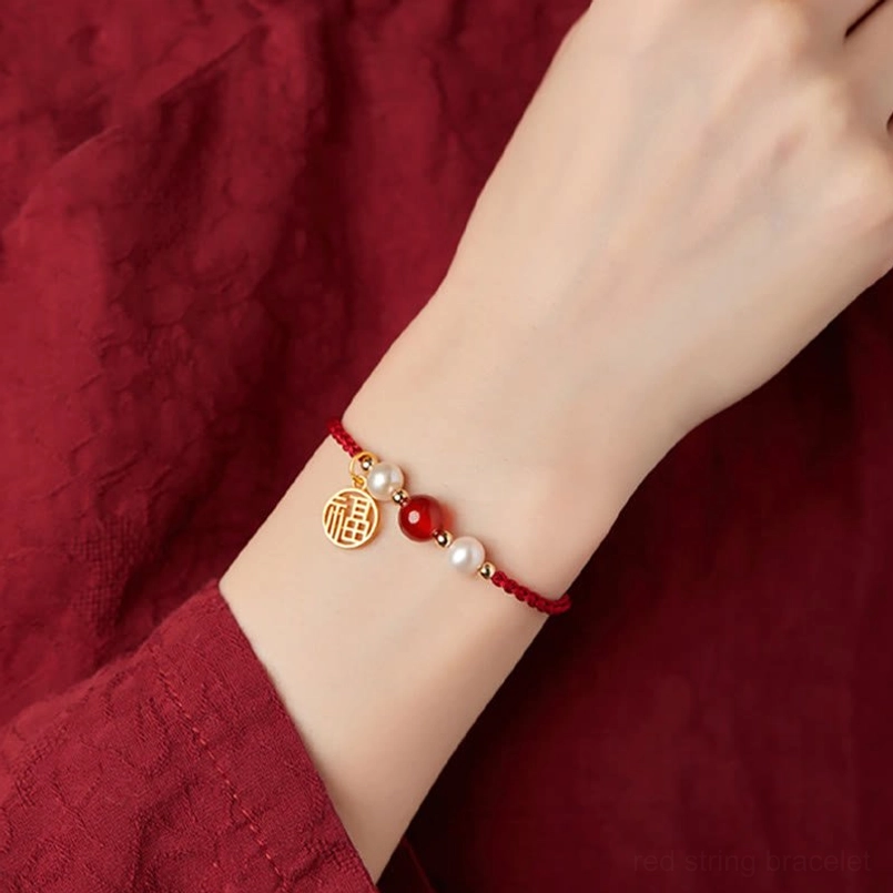 Red string bracelet with agate pearl combination showing natural material quality and craftsmanship