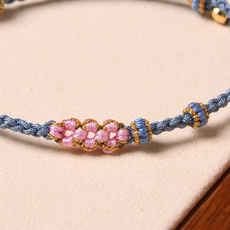 Red peach blossom protection bracelet with sacred red string and gold charms