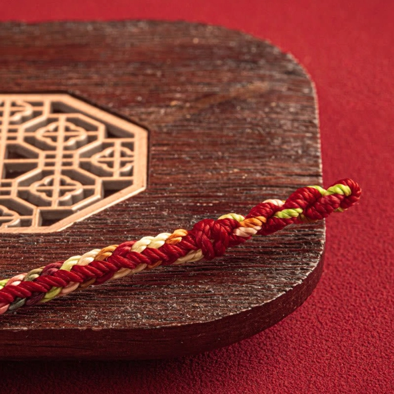 Multicolor rope segment red string bracelet twisted weave close-up