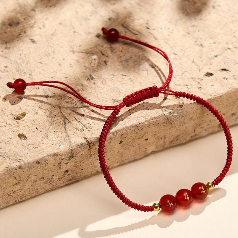 Angel Number Braided Red String Bracelet side angle showing beads and woven cord detail