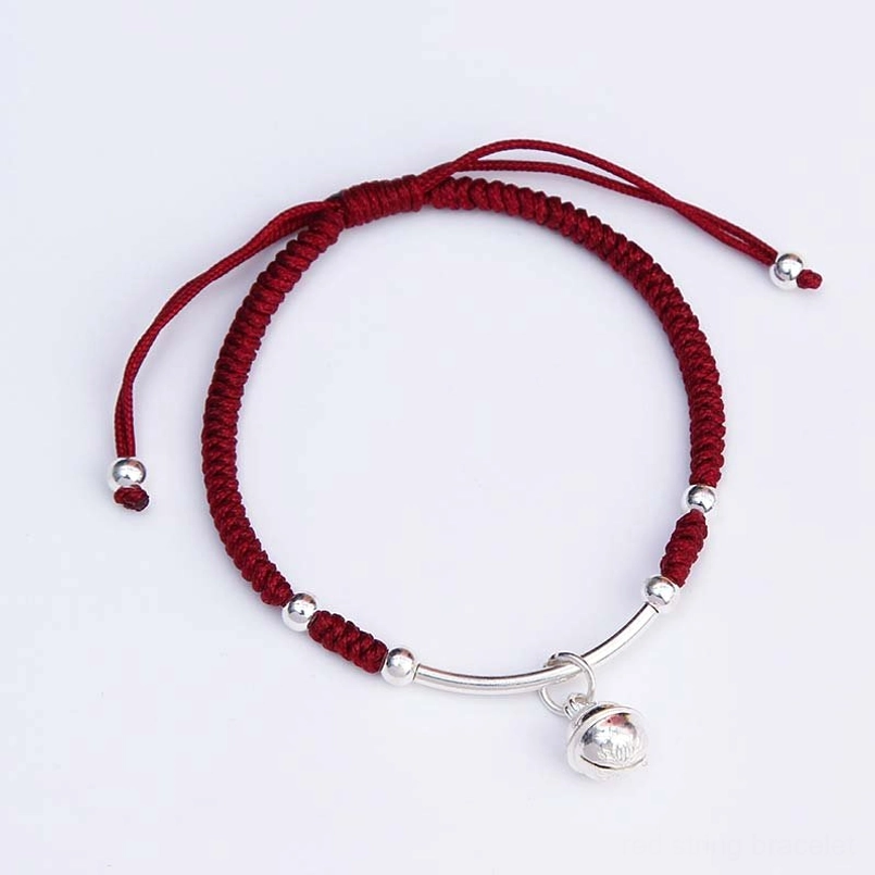 Handcrafted red string bracelet with silver beads and polished bell charm