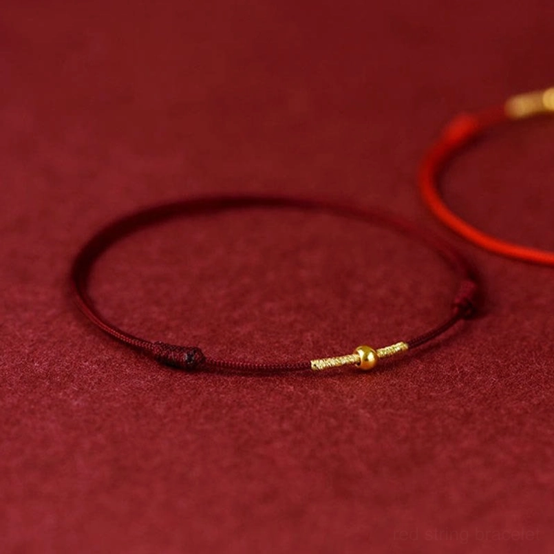 Red string braided bracelet with sterling silver wrapped gold metal hardware detail