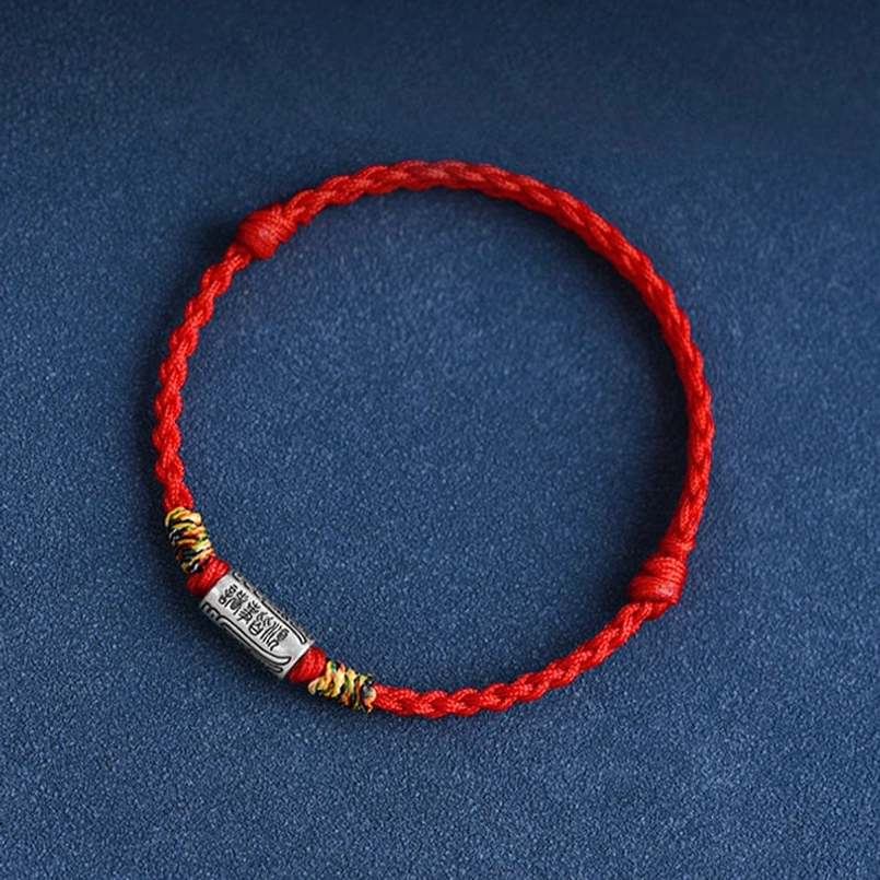 Single red woven lucky bracelet with engraved sterling silver tube charm