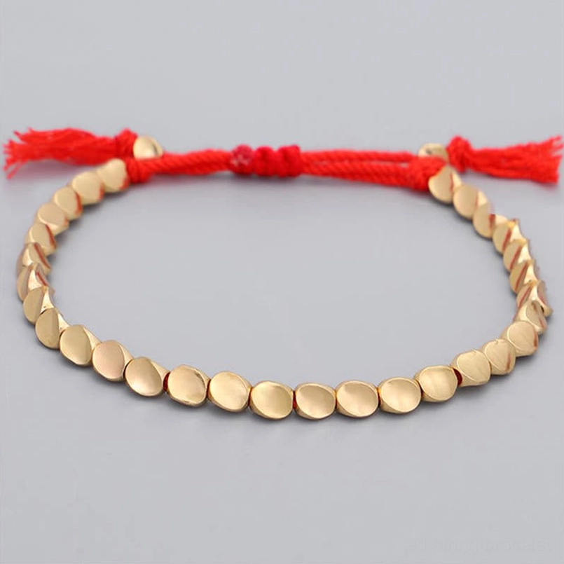Single red string protection bracelet with golden copper beads and adjustable cord