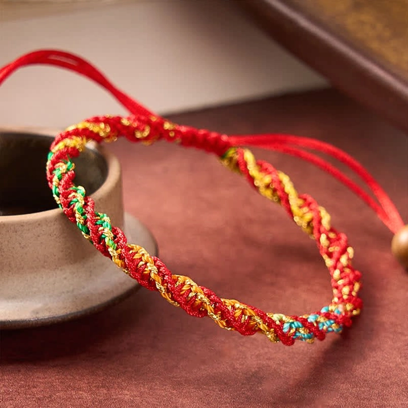 Spiral woven red string bracelet with drawstring cord, close-up side view