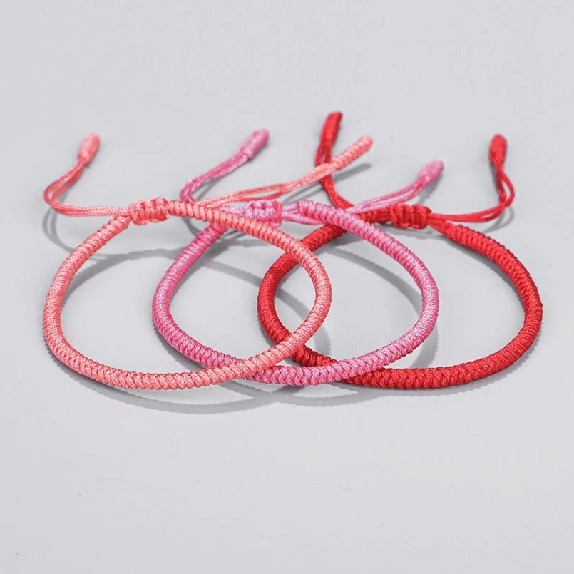 Red string bracelet worn on wrist Tibetan Buddhist protection amulet daily wear