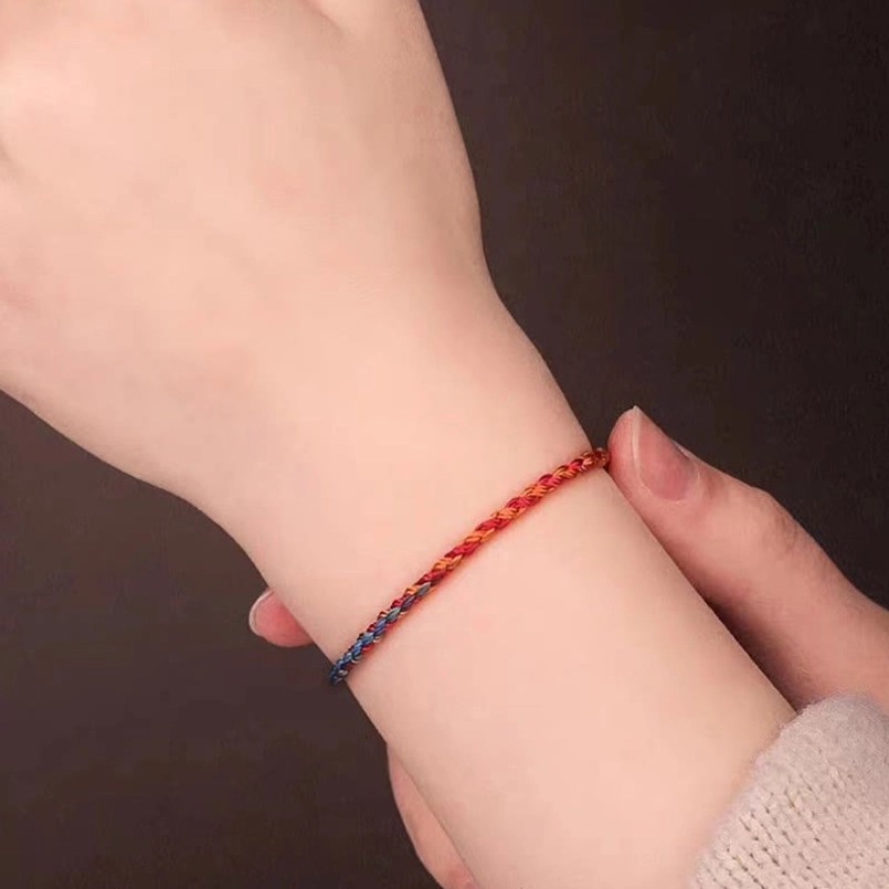 Slim multicolor protection bracelet worn on female wrist showing comfortable fit and natural wearing appearance