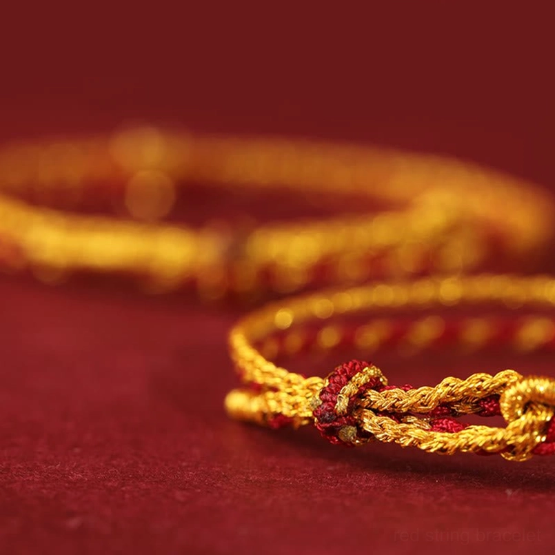 red string bracelet woven knotted connection close up detail