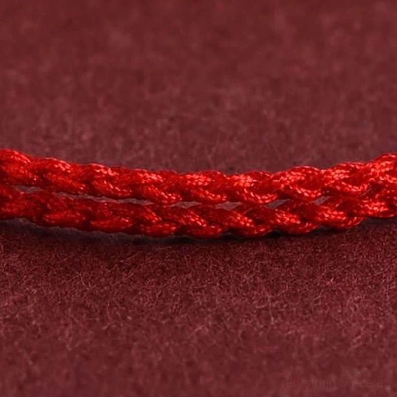 Red braided rope close-up showing twilled woven texture and vibrant solid red color