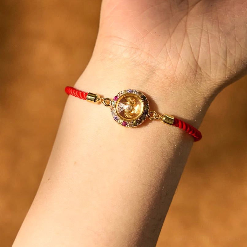 Red string bracelet worn on wrist, slim daily wearing fit with copper charm