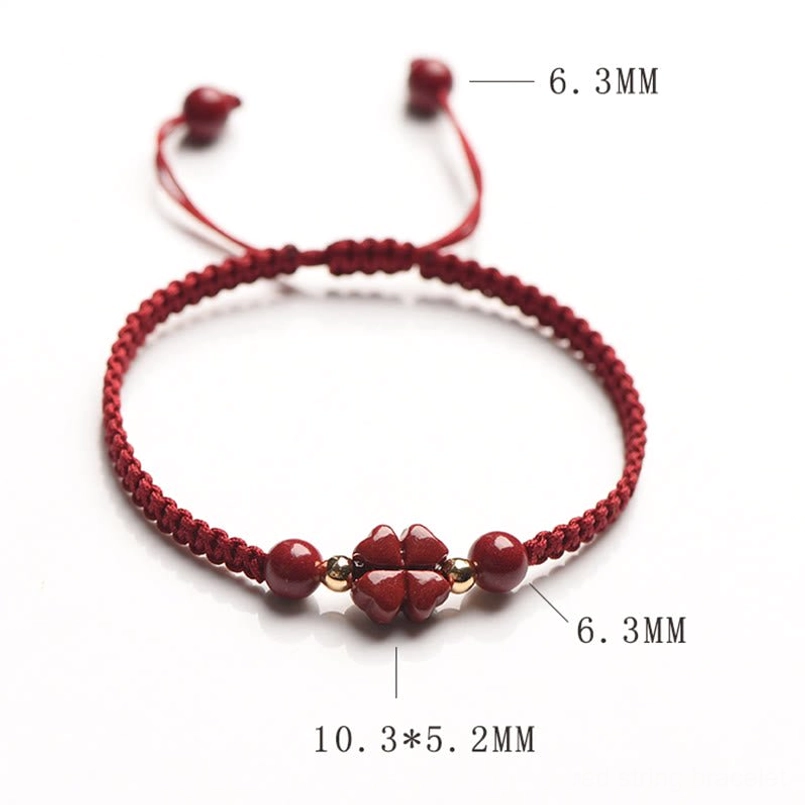 Red string bracelet with cinnabar beads fortune and protection symbol
