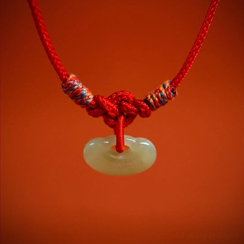 Red string pet collar with protective jade stone, handmade artisan craftsmanship