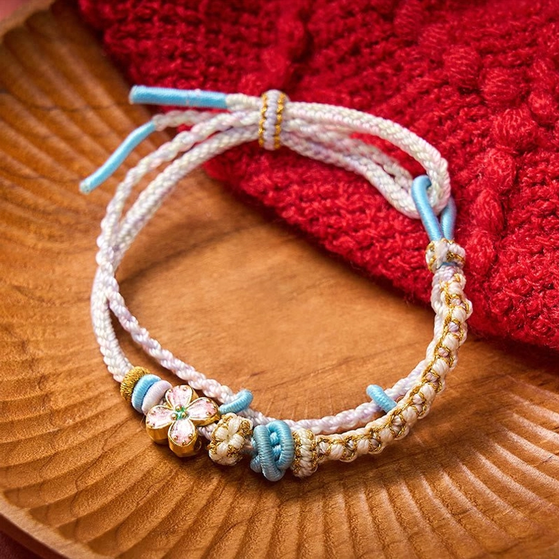 Handwoven red string destiny bracelet with traditional knot pattern