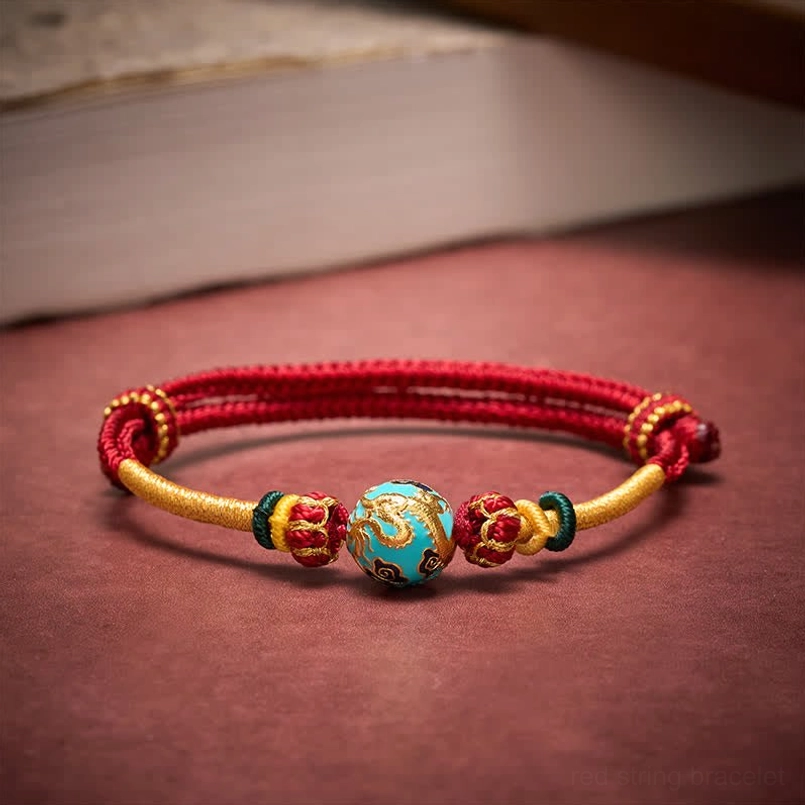 Red string dragon bead bracelet showcasing natural material handmade craftsmanship
