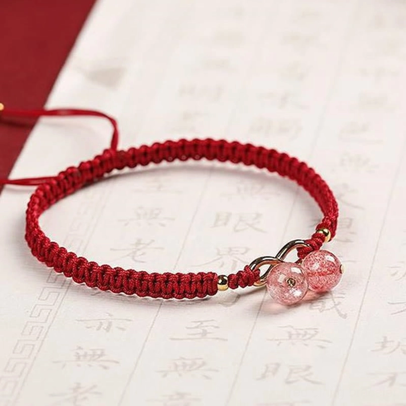 Red String Bracelet with Dual Crystal Pendants - Flat Lay Photography
