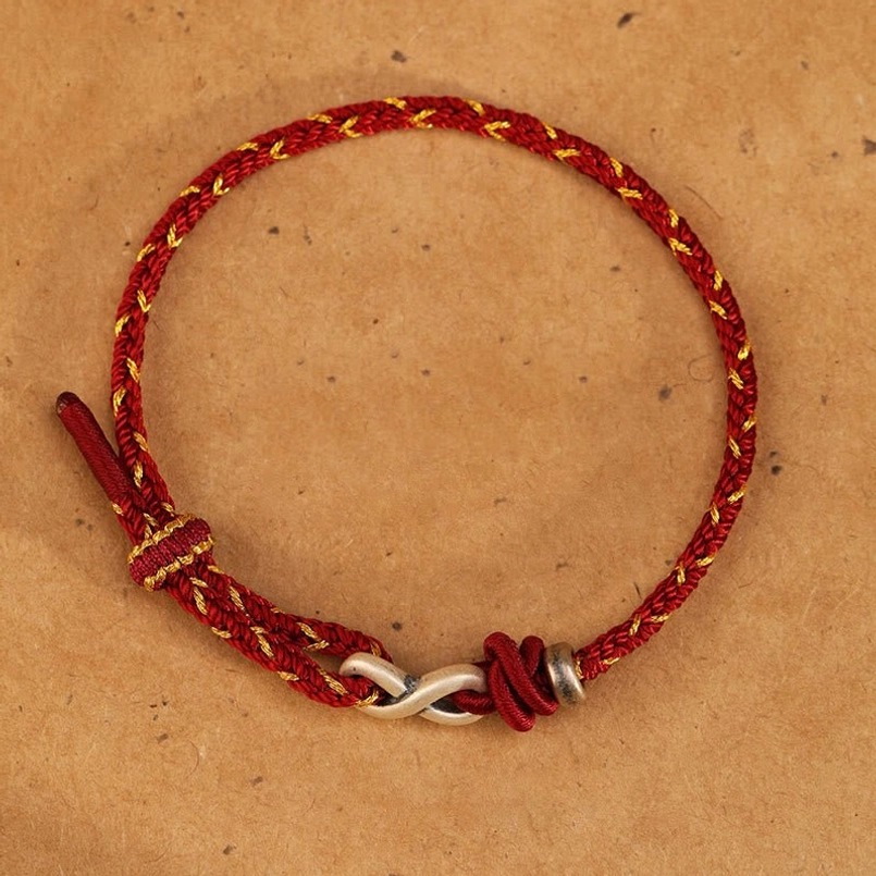 Red rope endless knot bracelet with polished sterling silver infinity charm and knot